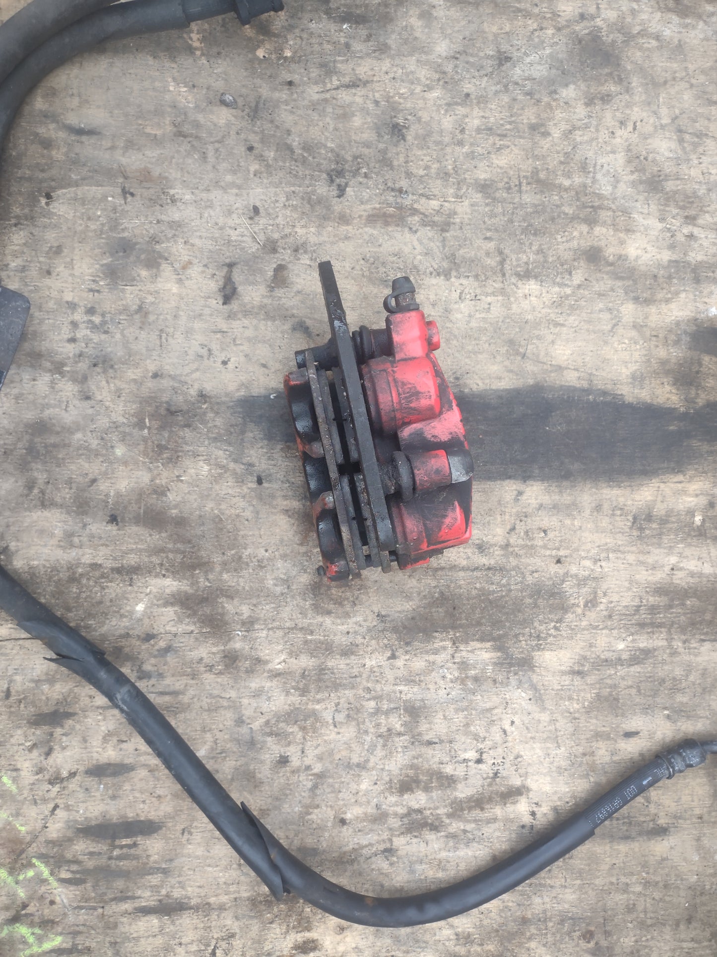 Honda ANC 125 / SH MODE 125 front brake calliper and hoses (OEM) used